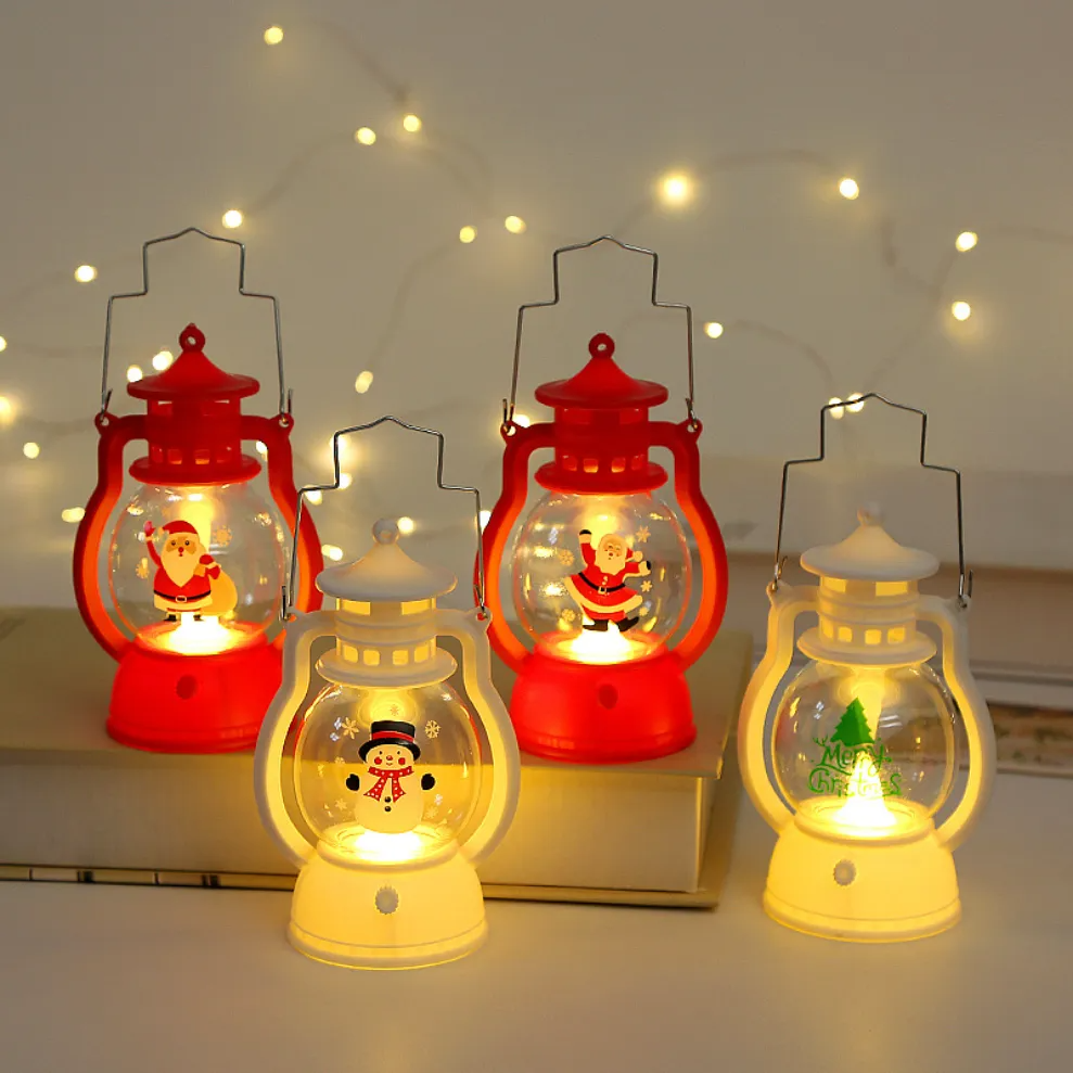 Set of decorative lanterns with Santa Claus and snowman figures on a soft focus background.