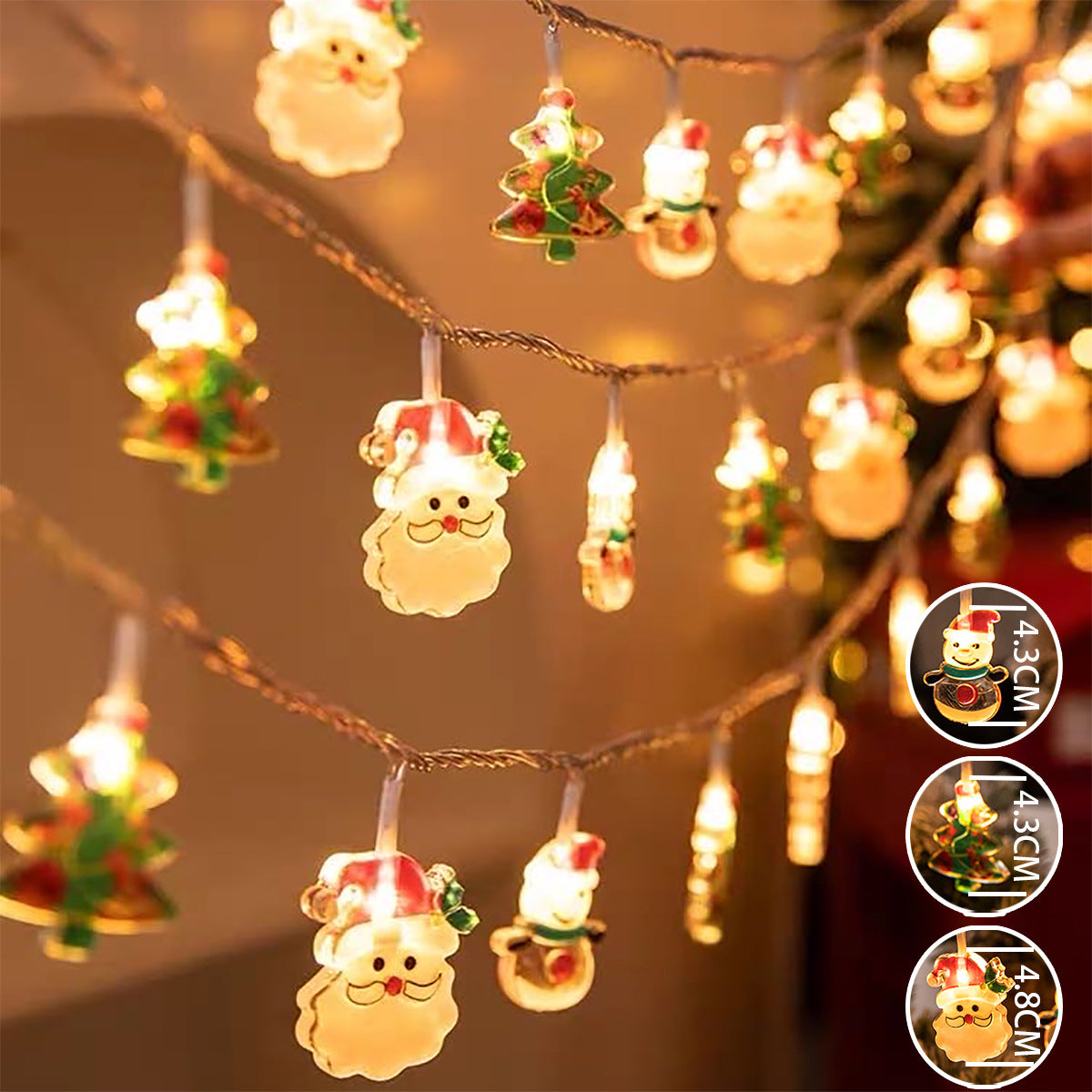 String lights with Santa Claus and Christmas tree designs on a blurred background