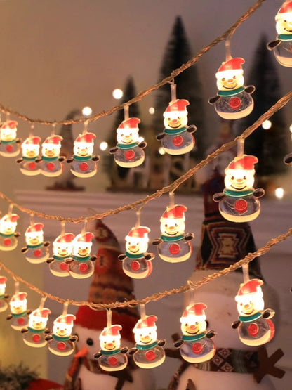 String lights with snowman design hanging against a festive background