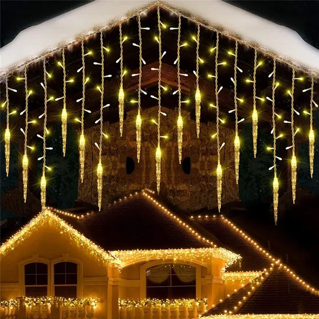 House exterior decorated with LED Icicle Christmas Lights Outdoor  on a dark night.