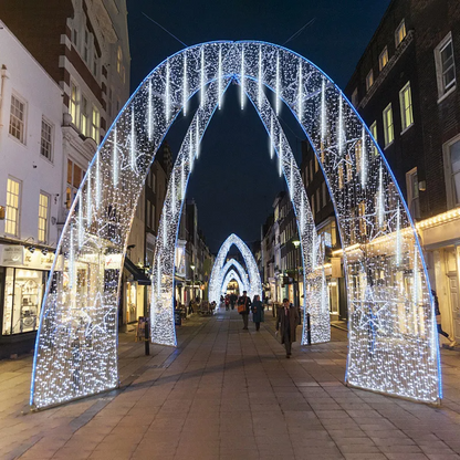 Decorative arches with LED Meteor Shower Lights Outdoor on a city street at night