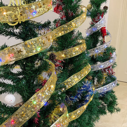 Decorated Christmas tree with gold and silver ribbon lights