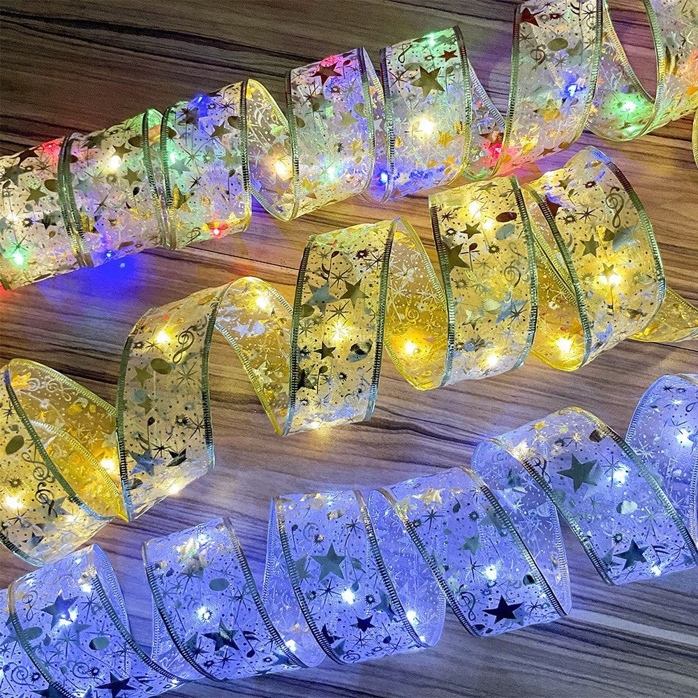 Decorative ribbon with embedded lights on a wooden surface
