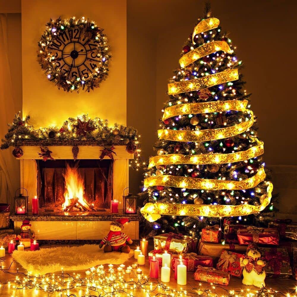 Decorated Christmas tree with New Christmas Tree Ribbon Lights and presents in a living room with a fireplace.