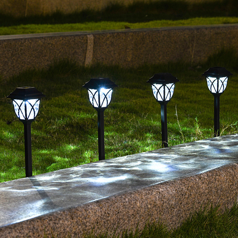 Outdoor Solar Garden Path Lights on grass next to a stone pathway