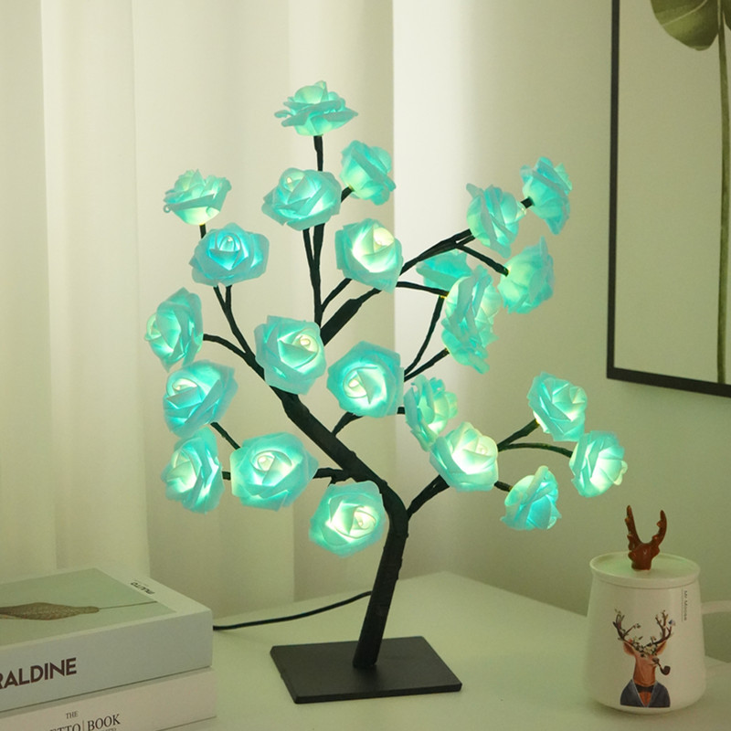 Rose Tree LED Table Lamp with glowing green flowers on a table.