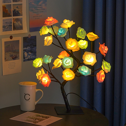 Rose Tree LED Table Lamp on a table with a mug and papers in a room setting.