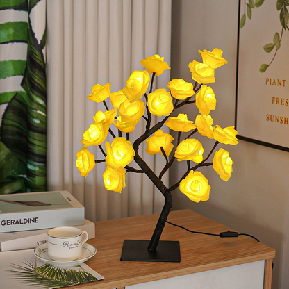 Rose Tree LED Table Lamp with yellow flowers on a wooden surface.
