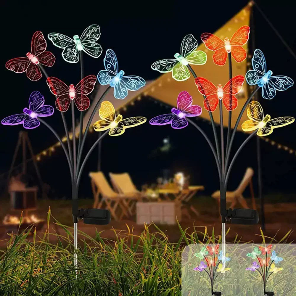 Colorful Solar Butterfly Garden Lights on stakes with a blurred outdoor background.
