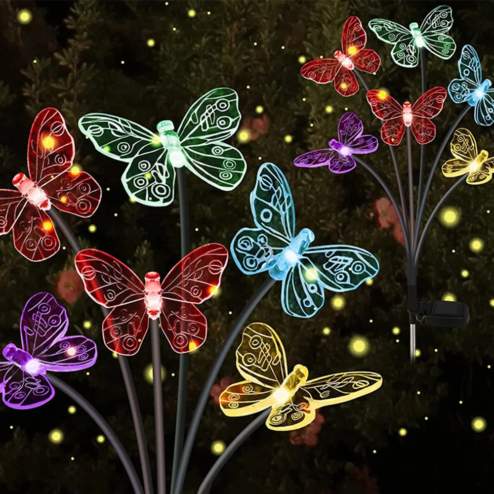 Solar Butterfly Garden Lights on sticks against a dark background.