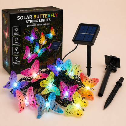 Solar Butterfly String Lights Outdoor packaging, solar panel, and stakes on a beige background