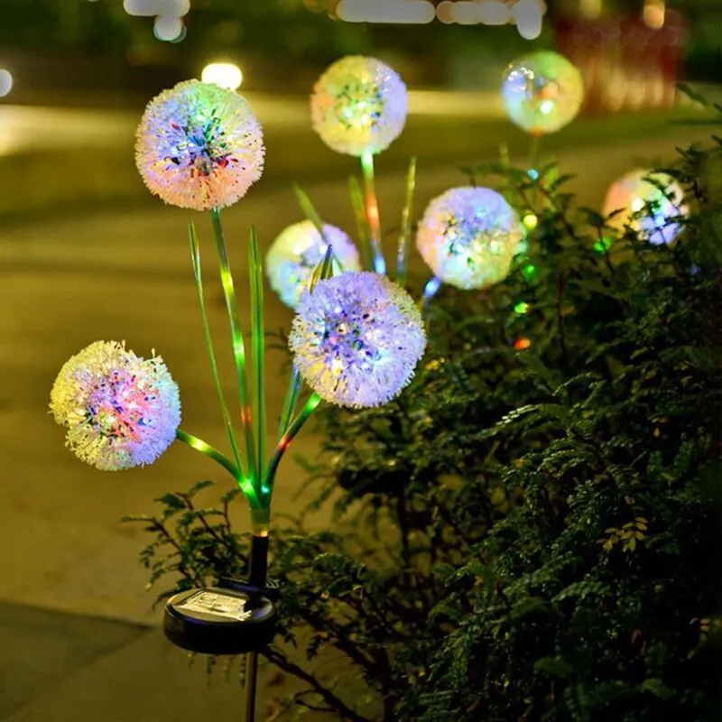 Solar Dandelion Garden Lights colorful LED balls on a plant-like stand in a garden setting.
