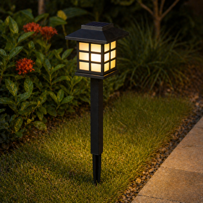 Solar Garden Path Lights Outdoor on a grassy area with plants and flowers in the background