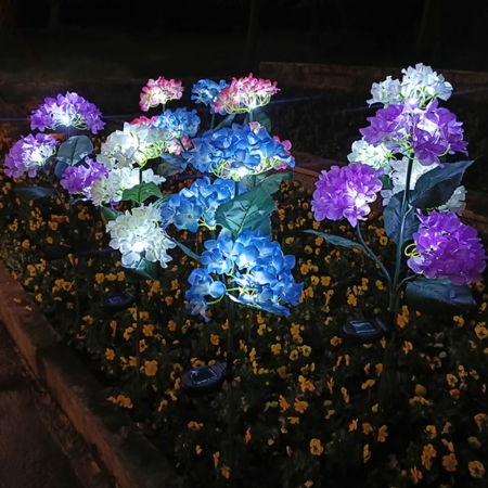 Solar Hydrangea Garden Lights with LED lights on a dark background