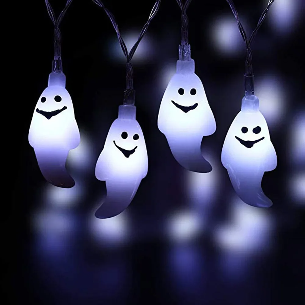 Solar LED Ghost String Lights with smiling faces on a dark background