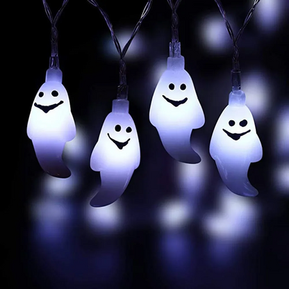 Solar LED Ghost String Lights with smiling faces on a dark background