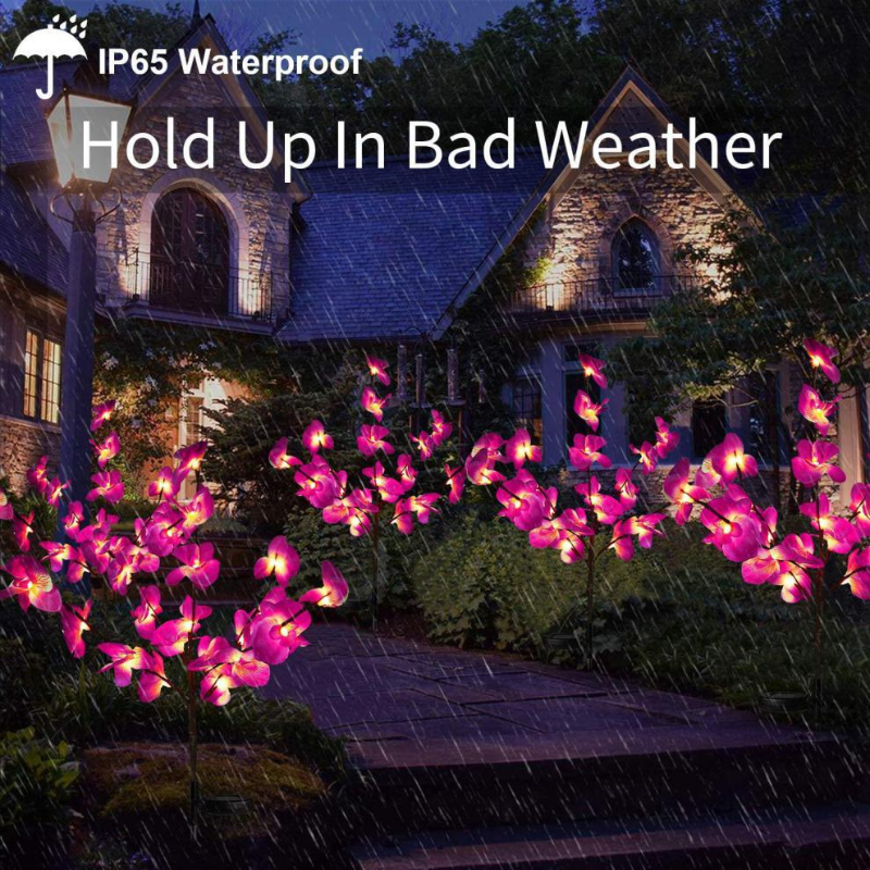 Solar Orchid Garden Lights on a house exterior with text 'IP65 Waterproof Hold Up In Bad Weather'.