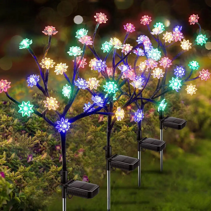 Solar Powered Flower Garden Lights on stakes with solar panels in a garden setting