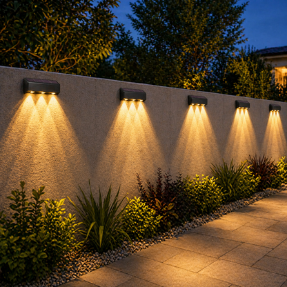 Solar Powered Garden Wall Light illuminating a garden pathway at night.