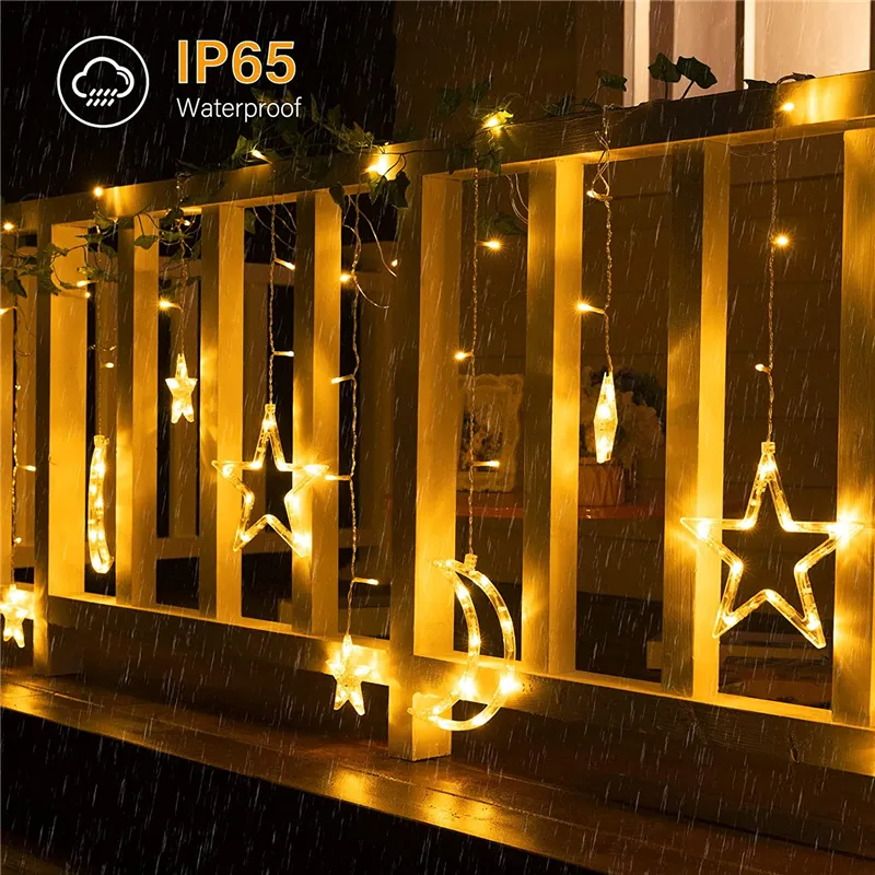 Solar Star Moon String Lights Outdoor on a wooden fence with 'IP65 Waterproof' label.