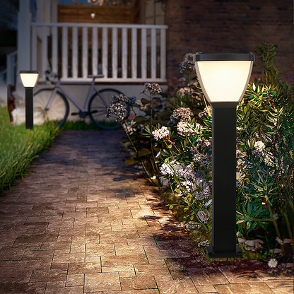 Pathway with Waterproof Outdoor Solar LED Pillar Light on either side, leading to a white bench.
